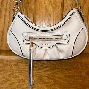 Aldo crossbody. Light cream. NWT. Two straps.
